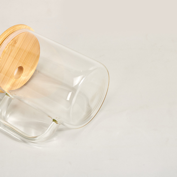 display-of-clear-15oz-sublimation-glass-tumbler-with-handle-and-bamboo-lid