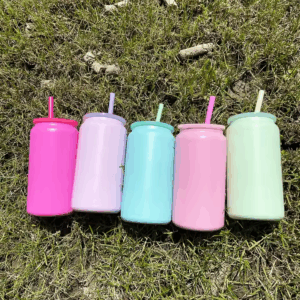 candy-colored-16-oz-stainless-steel-soda-cans-on-lawn-background