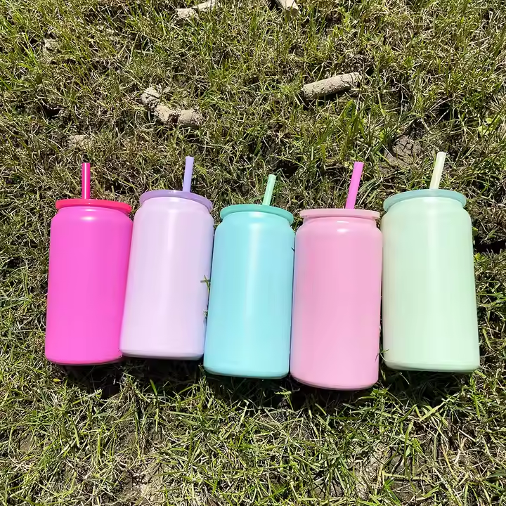 candy-colored-16-oz-stainless-steel-soda-cans-on-lawn-background